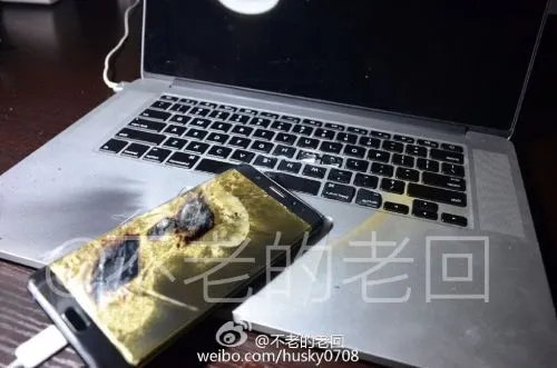 三星Note 7国行版第四次爆炸 用原装充电器正充电它就炸了？！熏黑旁边的mac！